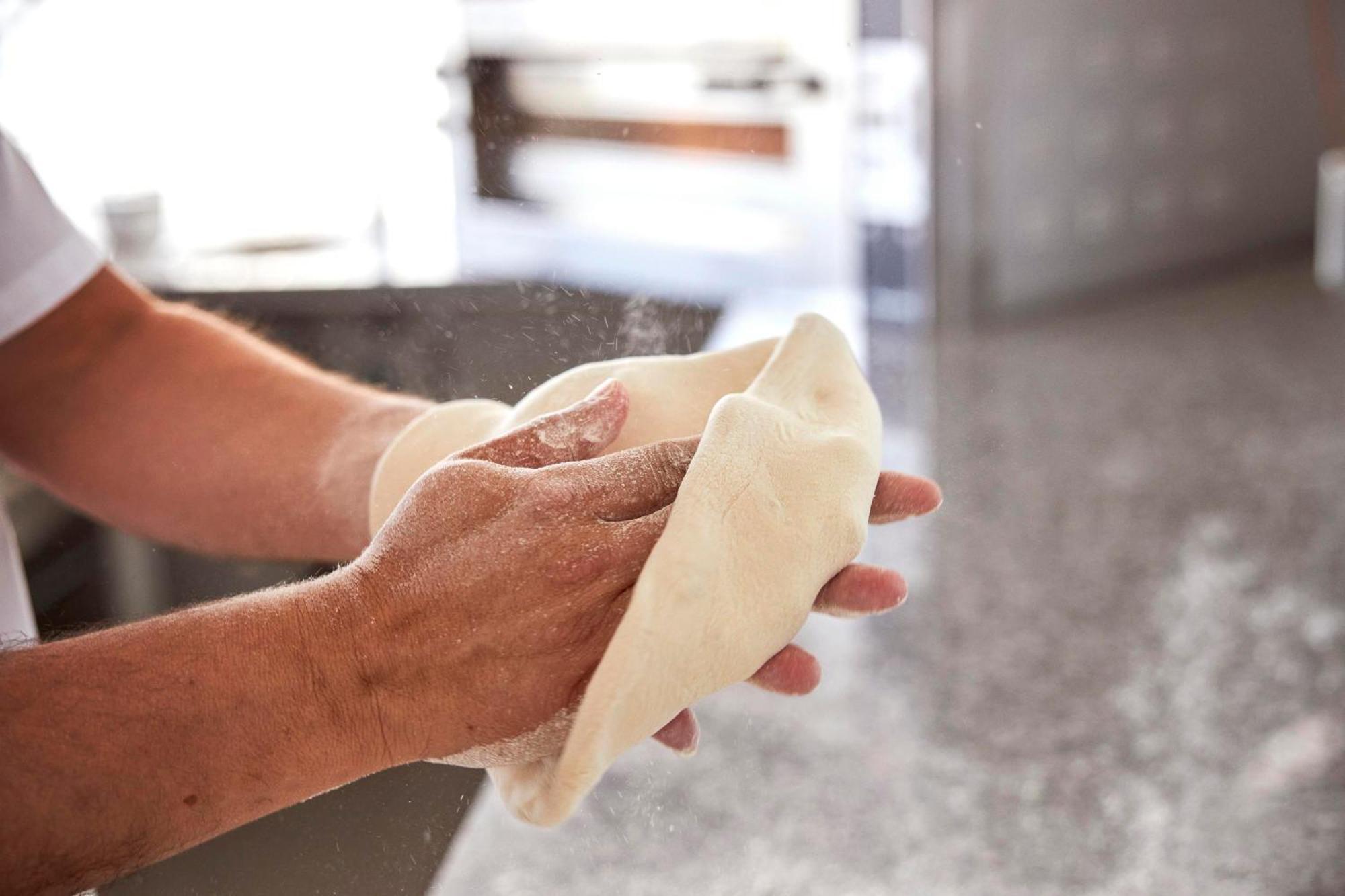 Monchique Resort & Spa Exterior photo A baker kneading bread dough
